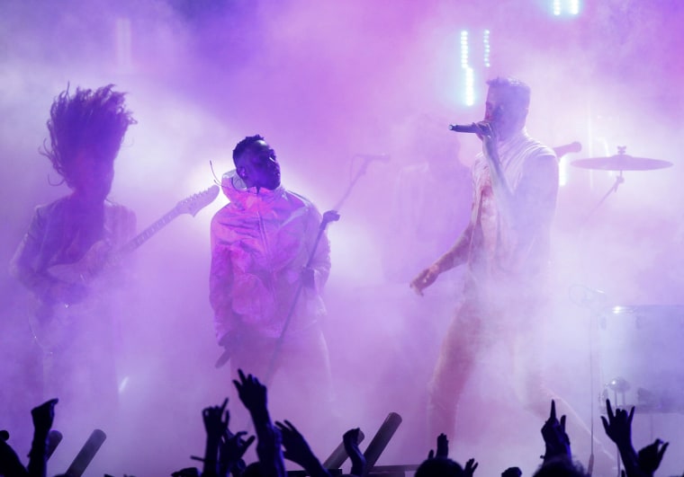 Image: Kendrick Lamar and Imagine Dragons perform \"Radioactive\" at the 56th annual Grammy Awards in Los Angeles