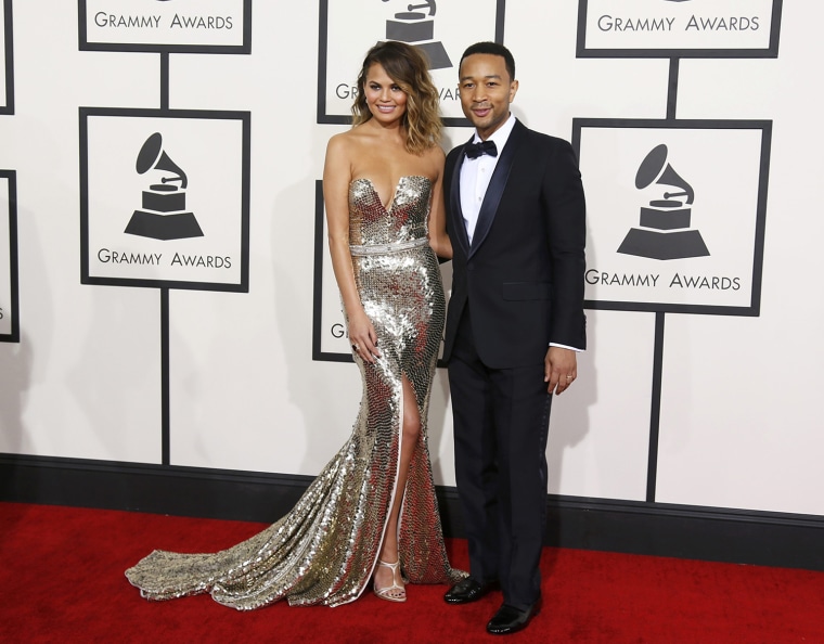 Image: John Legend and his wife Chrissy Teigen arrive at the 56th annual Grammy Awards in Los Angeles