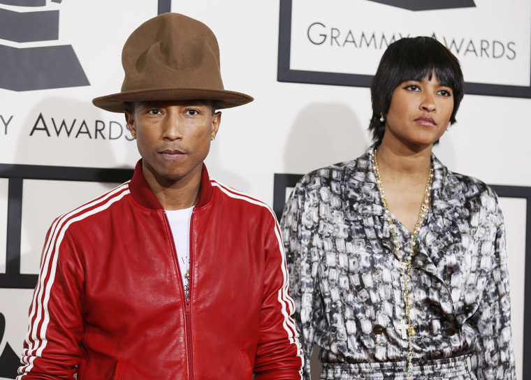 Image: Pharrell Williams and Helen Lasichanh arrive at the 56th annual Grammy Awards in Los Angeles