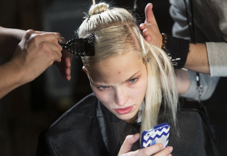 Image: A model has her hair done backstage before the Donna Karan New York show during New York Fashion Week