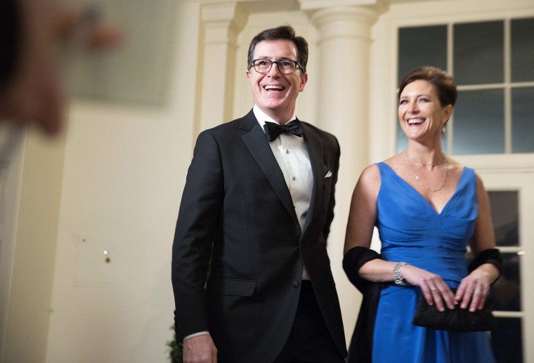Image: Comedian Stephen Colbert and his wife Evie Colbert arrive for the State Dinner being held for French President Francois Hollande at the White House