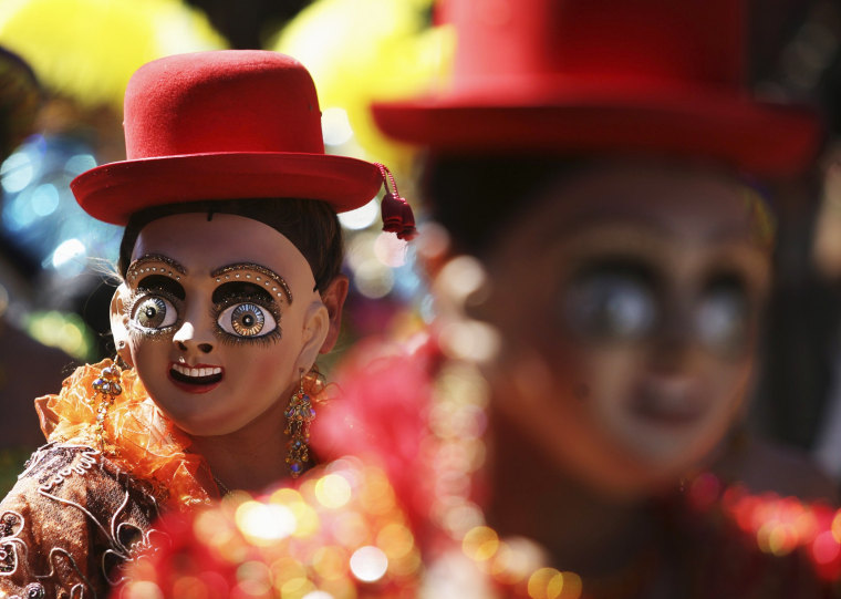 Image: Members of \"Diablada Oruro\" perform during Carnival parade in Oruro