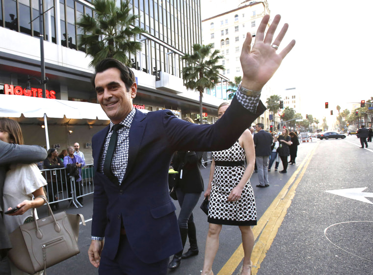 Image: Cast member Burrell waves at the premiere of \"Muppets Most Wanted\" at El Capitan theatre in Hollywood