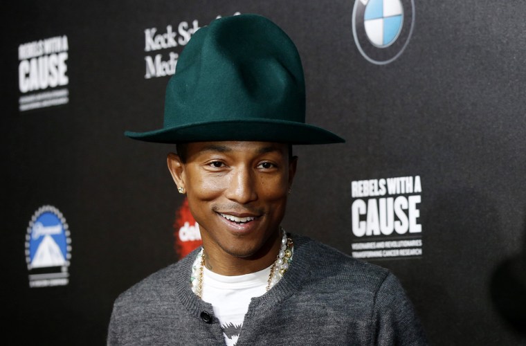 Image: Pharrell Williams poses at second annual \"Rebels With a Cause\" gala at Paramount Pictures Studios in Los Angeles