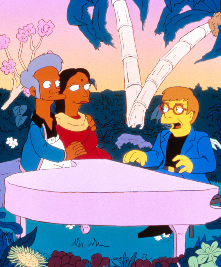 SIMPSONS, Apu and Manjula Nahasapeemapetilon with Elton John, 1989-. TM and Copyright Â© 20th Century Fox Film Corp. All rights reserved. Courtesy: Everett Collection