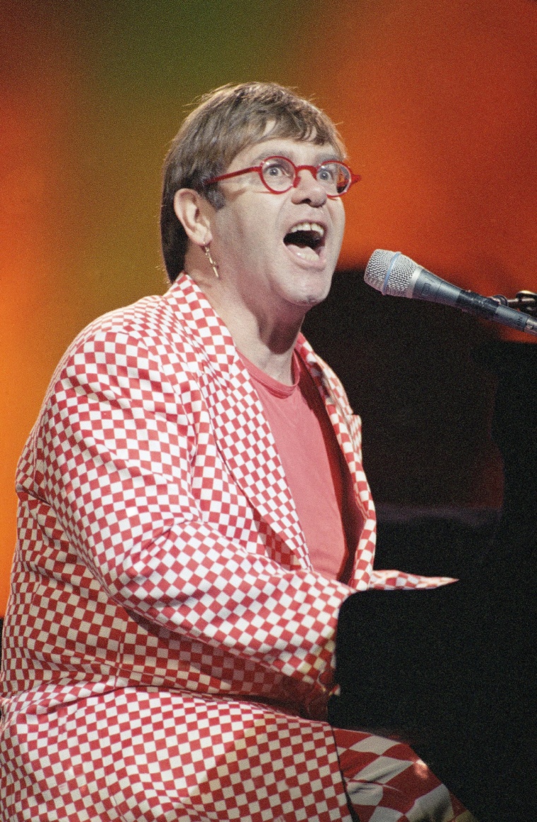 Elton John performs at his concert in the Kremlin Palace of Congresses in Moscow, June 6, 1995. The British rock legend is in Russia for two days. He flew in to Moscow only two hours before the first concert began. (AP Photo/Sergei Karpukhin)
