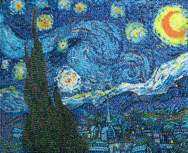 In celebration of Vincent van Gogh's masterwork, The Starry Night, Jelly Belly commissioned artist Kristen Cumings to recreate the famous image completely in Jelly Belly jelly beans. Because Van Gogh's brush strokes went in a circular, swirling pattern, Cumings had to place each individual bean in the same direction as the brushstroke to mimic the effect and recreate it on a larger scale.