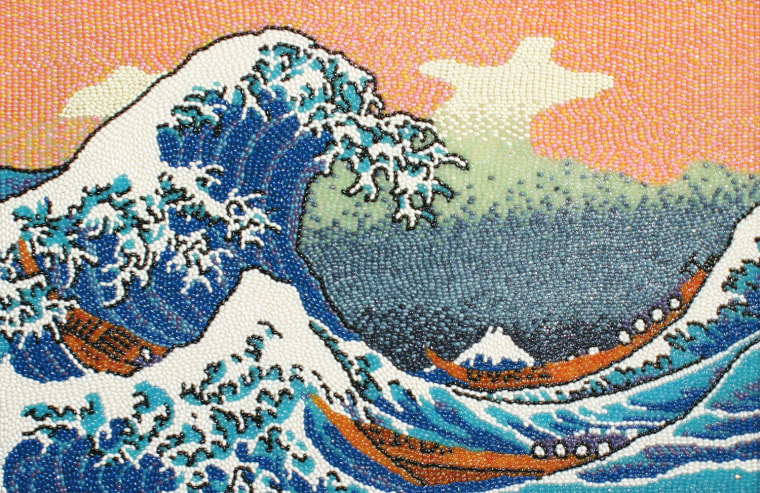 Katsushika Hokusai's The Great Wave Off Kanagawa is comprised of a wide range of Jelly Belly bean flavors used to capture the intense blue of the waves and the white of the foam caps. The artist went to great lengths to recreate the intricate details of the original wood block print, even using just three beans to depict the fishermen kneeling on the boats caught in the waves.