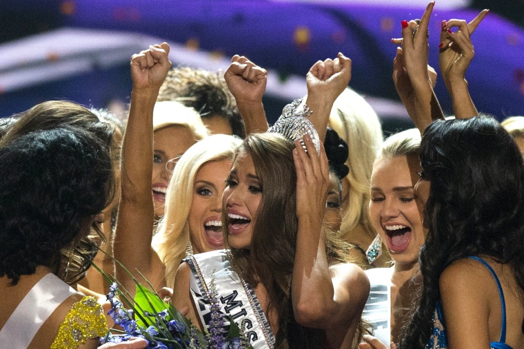 Image: Fellow contestants celebrate with Miss Nevada Nia Sanchez after she won the 2014 Miss USA beauty pageant in Baton Rouge, Louisiana