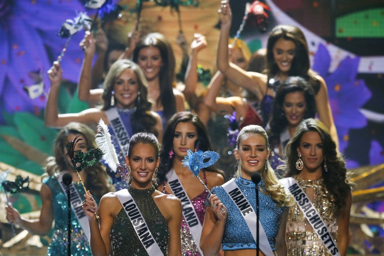 Image: Miss USA contestants take the stage during the 2014 Miss USA beauty pageant in Baton Rouge, Louisiana