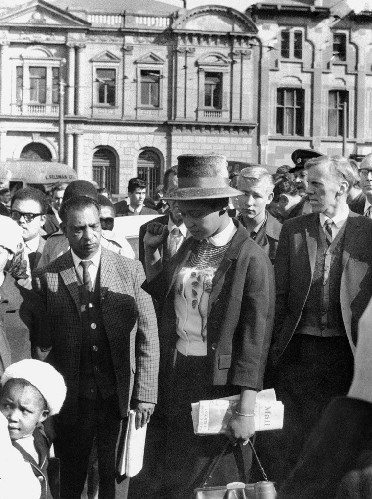 Winnie Mandela (C), leaves the Palace of