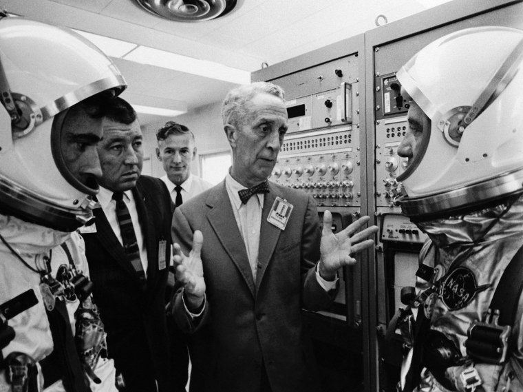 Artist Norman Rockwell, center, talks with astronauts John W. Young, left, and Virgil Grissom, right, at Cape Kennedy in Florida, on September 30, 1964.   The two pilots have been selected to fly the first manned Gemini orbital flight scheduled for 1965 when they will co-pilot Gemini III.   Rockwell is doing a series of paintings at the National Aeronautics and Space Administration's Cape Kennedy spaceport.  (AP Photo)