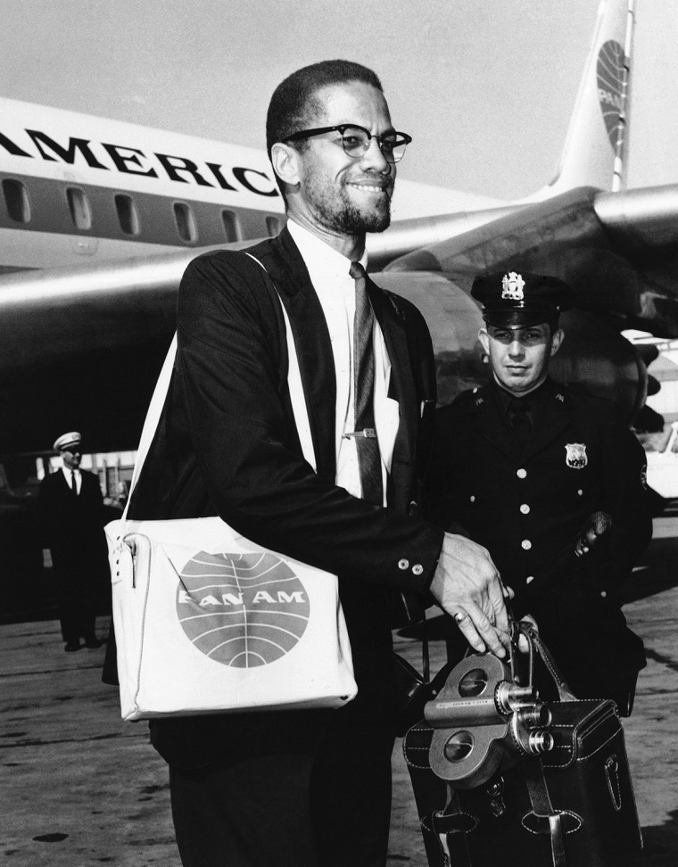 Black Muslim leader Malcolm X arrives in New York at Kennedy Airport after a trip to the Middle East, May 22, 1964. (AP Photo/Pan American Airways)