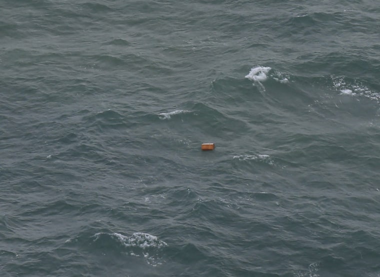 Relatives Mourn as Bodies are Recovered in AirAsia Crash