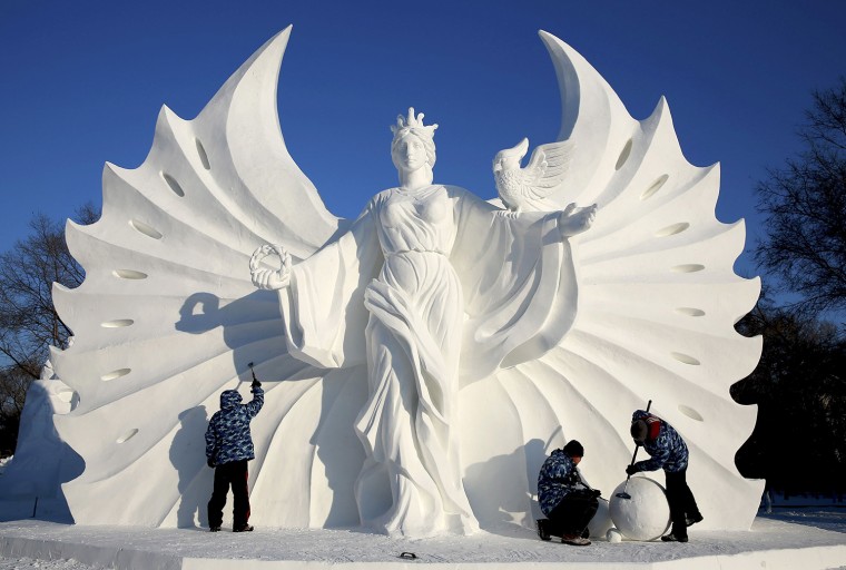 Image: Workers polish a snow sculpture ahead of the 16th Harbin Ice and Snow World in Harbin
