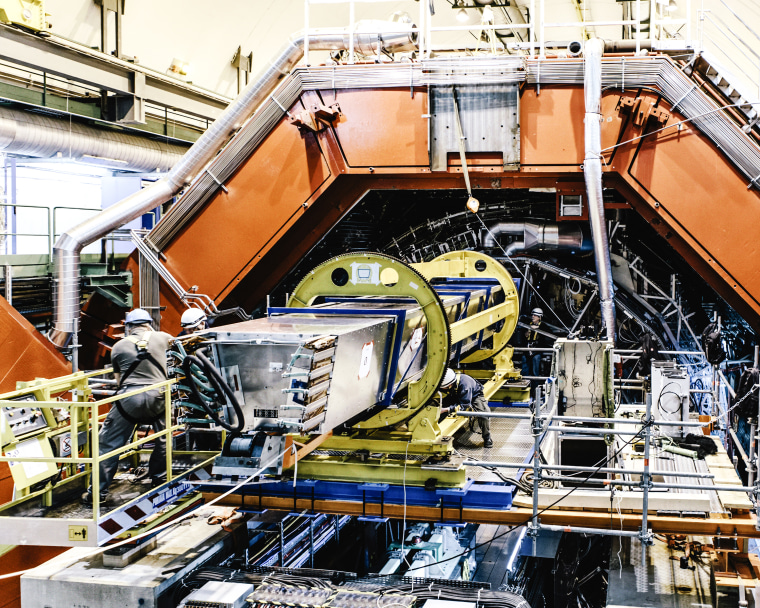 Last maintenance work inside the ALICE experiment. before running again in 2015 after a 2-year technical stop of the LHC. The ALICE collaboration uses the 10,000-tonne ALICE detector ? 26 m long, 16 m high, and 16 m wide ? to study quark-gluon plasma. ALICE (A Large Ion Collider Experiment) is a heavy-ion detector on the Large Hadron Collider (LHC) ring. It is designed to study the physics of strongly interacting matter at extreme energy densities, where a phase of matter called quark-gluon plasma forms. The detector sits in a vast cavern 56 m below ground close to the village of St Genis-Pouilly in France, receiving beams from the LHC.
The collaboration counts more than 1000 scientists from over 100 physics institutes in 30 countries.