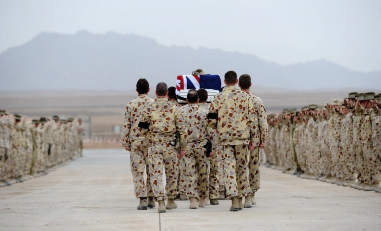 Image: Australian Defence Force engineers carry the casket of their friend and colleague Cpl. Atkinson at Multinational Base Tarin Kowt in Uruzgan province