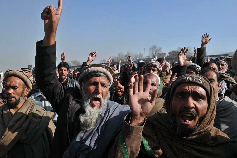 Image: Afghan men shout slogans during a demons