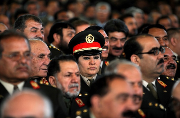 Image: Afghan officers listen to a speech by Af