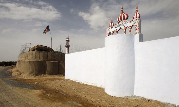 Image: A new mosque sits next to a U.S.-Afghan military post in the village of Tarok Kalache in the Arghandab Valley