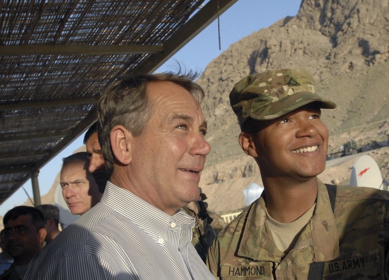 Image: US House Speaker John Boehner of Ohio poses for a photo with an unidentified Ohio soldier during a visit to the Arghandab Valley of Afghanistan