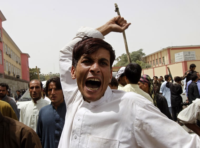 Image: An Afghan man gestures as he shouts anti-government slogans during a demonstration in Kabul