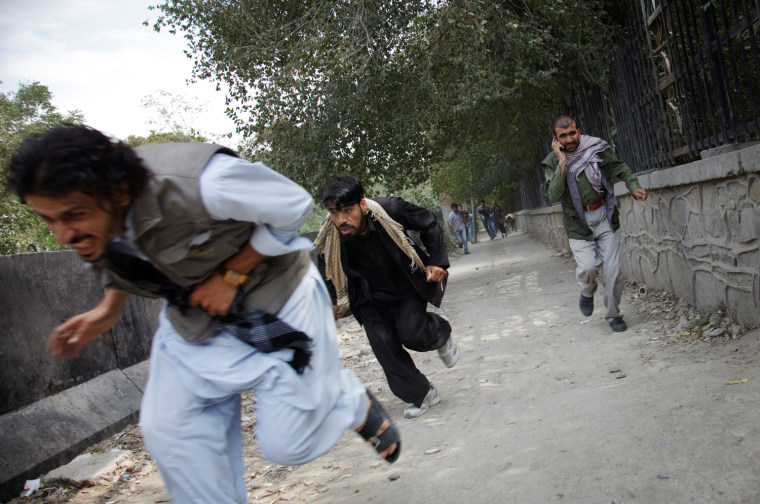 Image: People run for safety during an assault on the U.S. Embassy and NATO headquarters in Kabul,