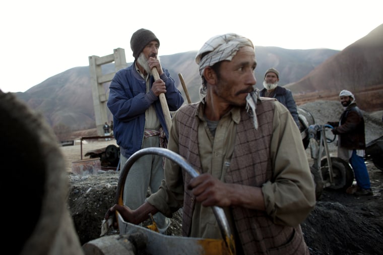 Image: Men work to a bridge funded by the Stabilisation Program North Afghanistan near Kunduz