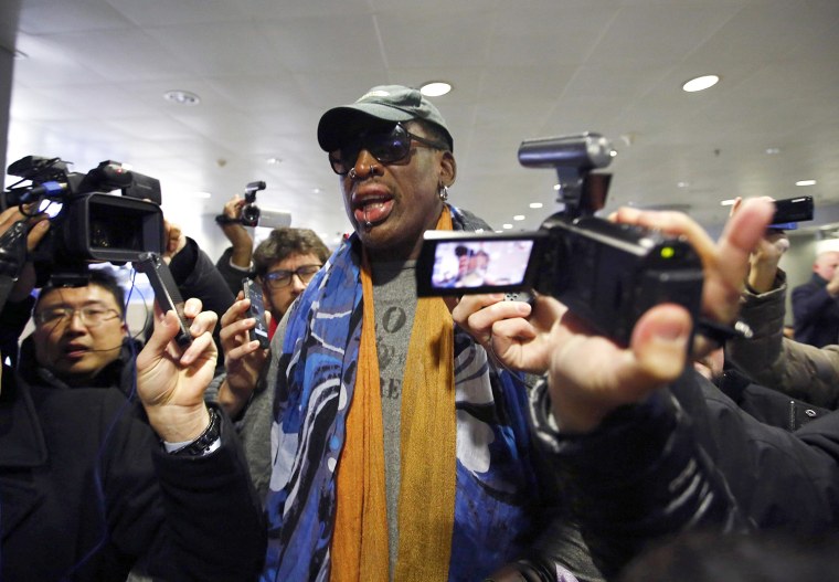 Image: Former NBA basketball player Rodman talks to the media at Beijing International Airport