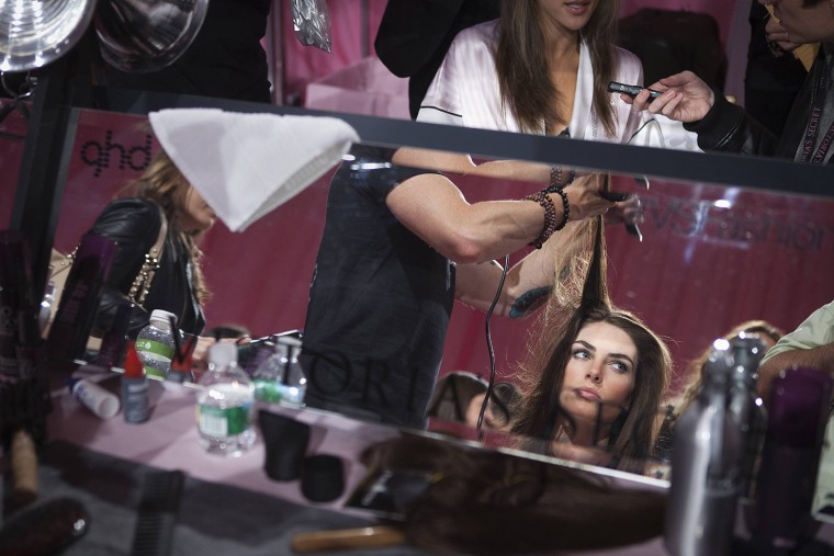 Image: Model Hilary Rhoda has her hair done backstage before the taping of the 2013 Victoria's Secret Fashion Show in New York
