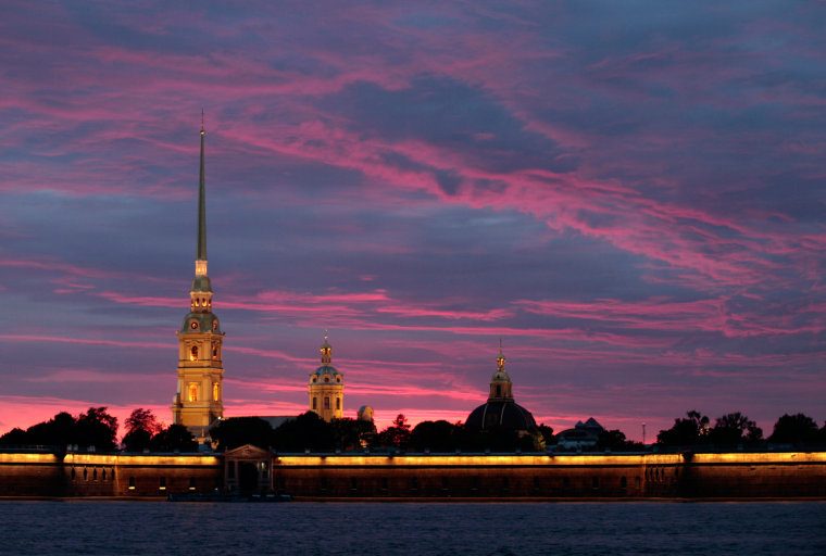 In this photo take on Monday evening, July 27, 2009, St. Peter and St. Paul Cathedral in seen on the bank of the Neva River  in St. Petersburg, Russia.. (AP Photo/Dmitry Lovetsky)