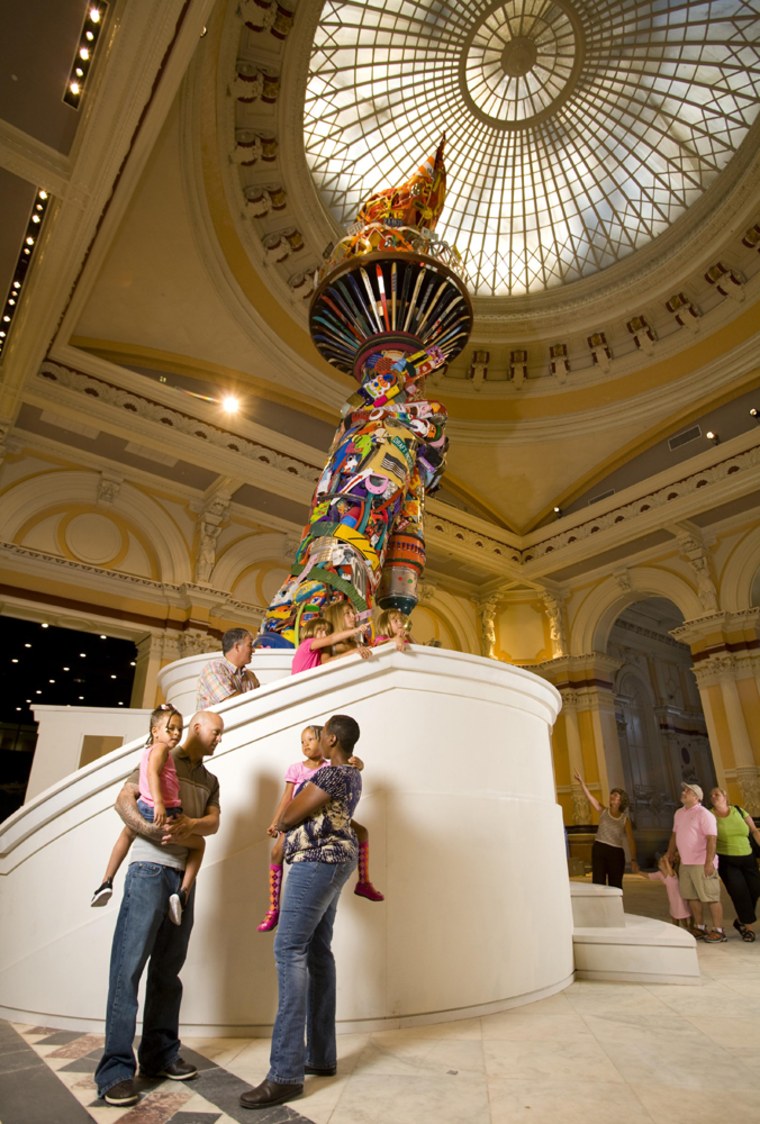 In this undated photo released by the Please Touch Museum, a life-sized replica of the Statue of Liberty's Arm & Torch, a sculpture built of toys and found objects by Philadelphia artist Leo Sewell, greets visitors in the Museum's Great Hall. (AP Photo/Michael Branscom, Please Touch Museum) ** NO SALES **