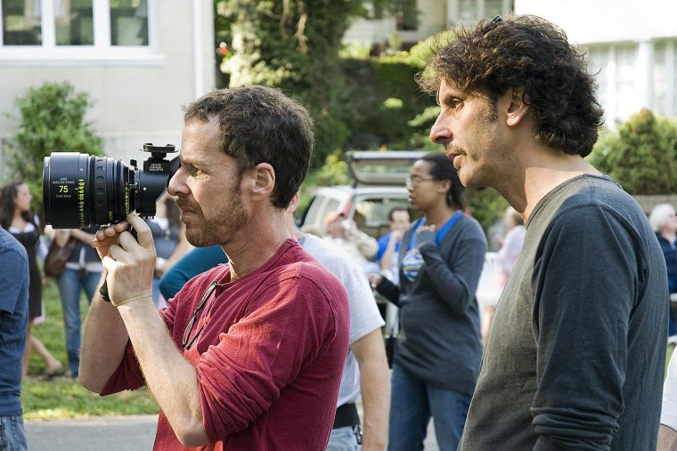Writers/directors Ethan (left) and Joel Coen (right) on location
during the filming of Burn After Reading