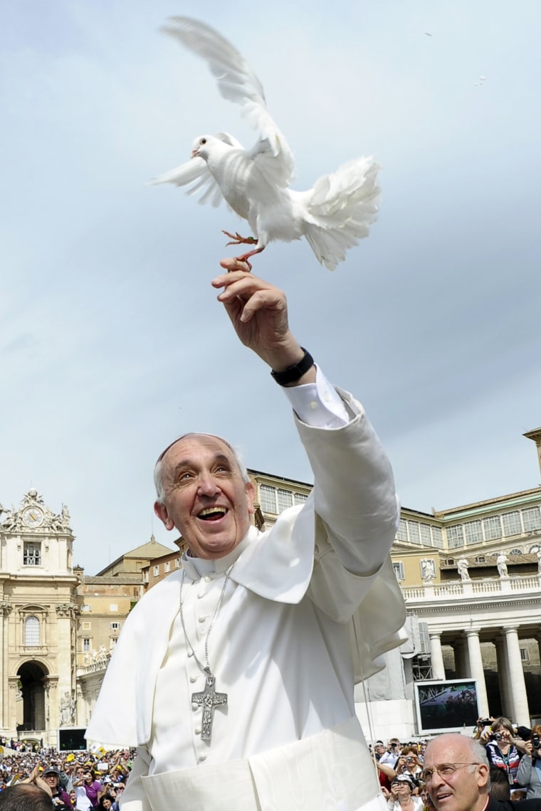 Image: Pope Francis holds a dove before his Wednesday general audience at Saint Peter's Square at the Vatican