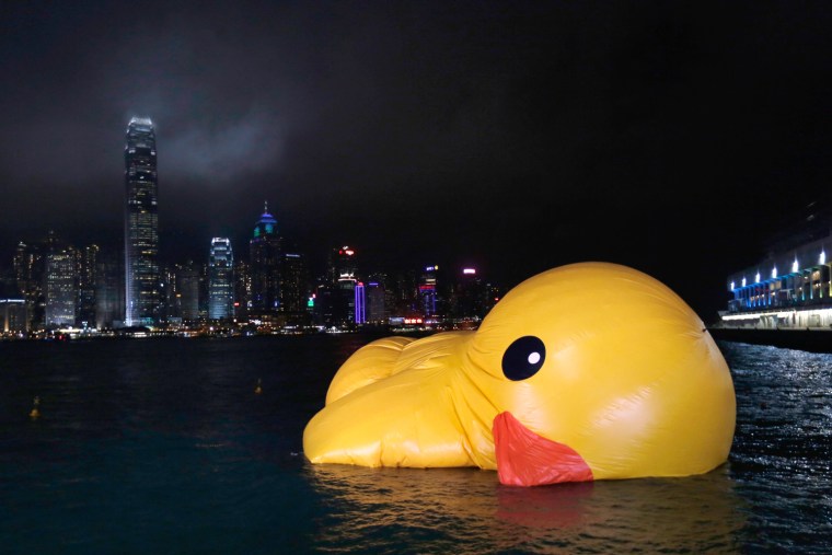 Image: A deflated Rubber Duck by Dutch conceptual artist Florentijn Hofman floats on Hong Kong's Victoria Harbour