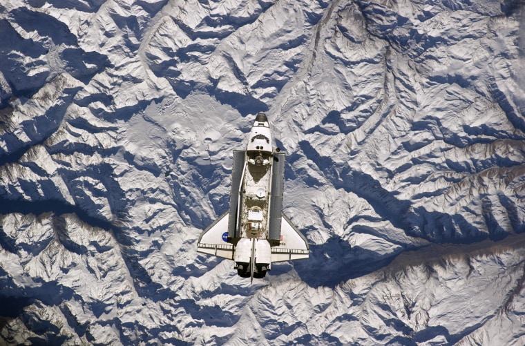 Image: The Space Shuttle Atlantis is backdropped against the Andes Mountains near the border of Argentina and Chile prior to docking