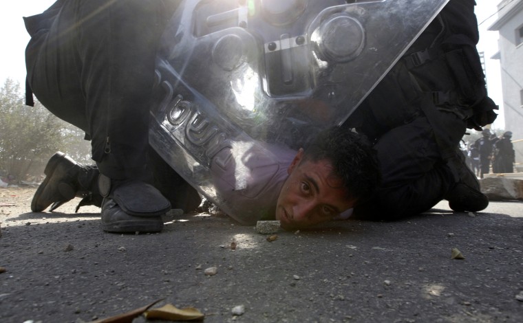 Image: Israeli riot police restrain a protester during clashes in Umm el-Fahm