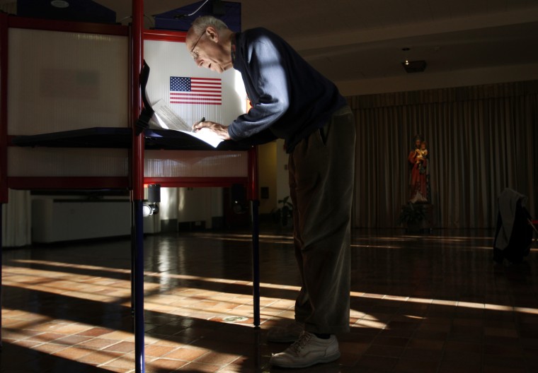 Image: A member of the Maryknoll Fathers and Brothers fills out his ballot at a polling station inside the Maryknoll Fathers and Brothers Spellman Room in Ossining