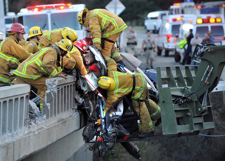Image: Mom, Kids Rescued As Car Dangles On SoCal Bridge