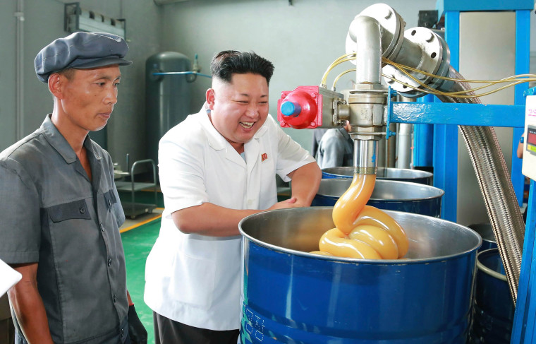 Image: KCNA picture shows North Korean leader Kim Jong Un smiling during a visit to the Chonji Lubricant Factory