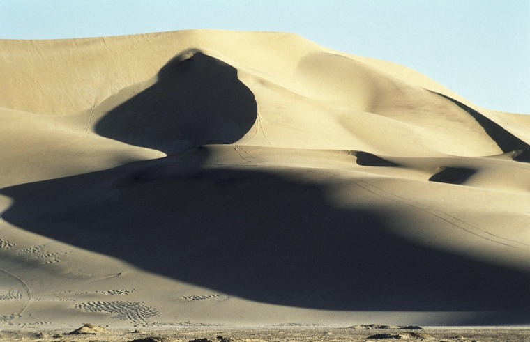 The sand dunes along the Skeleton Coast just outside Swakopmund in Namibia in July 1987, abut the Atlantic Ocean and are very tempting for motor bike riders although many conservationist complain that riding on the dunes is destroying the ecology of the area. (AP Photo/John Parkin)