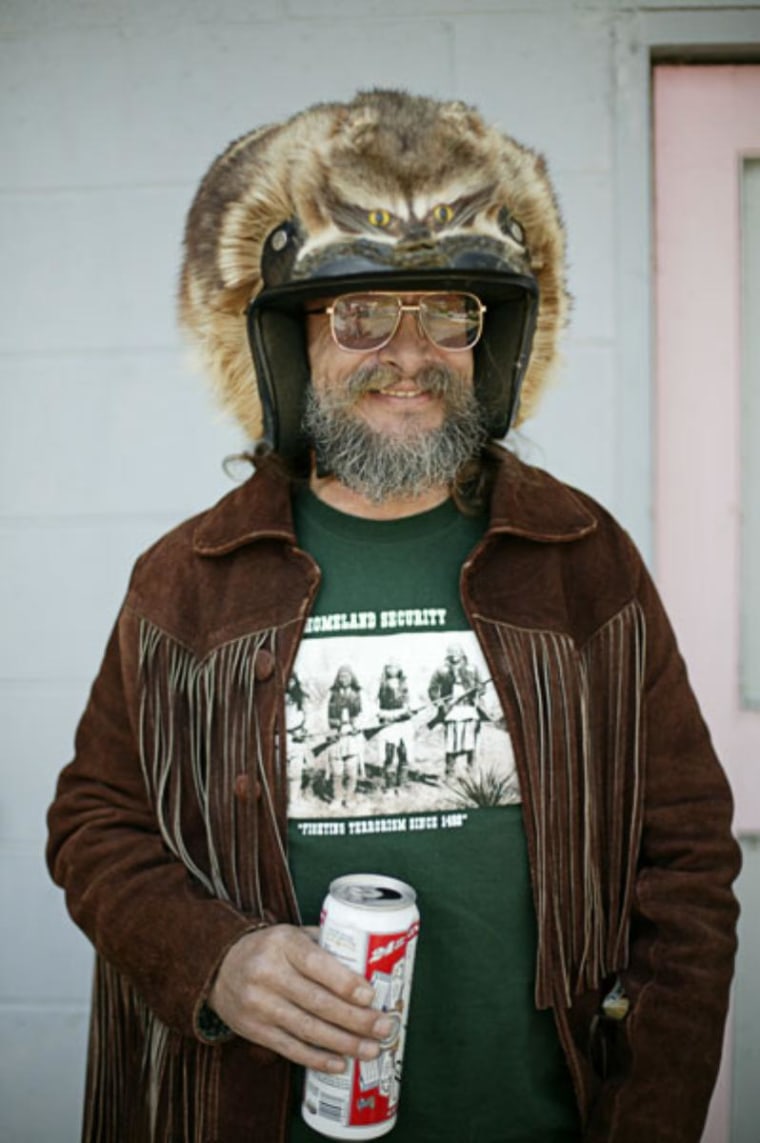 Davey Sprockett sporting his raccoon motorcycle helmet.