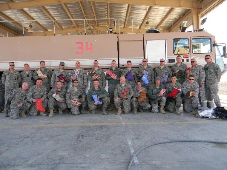 The 386th United States Air Force Fire Department stationed in Southwest Asia received hand-sewn christmas stockings stuffed with goodies and wanted to send their picture and a sincere thank you. “We appreciate all of the time spent by the volunteers who put these together for us and have put them to good use already. Happy Holidays from the 
USAF Firefighters.”