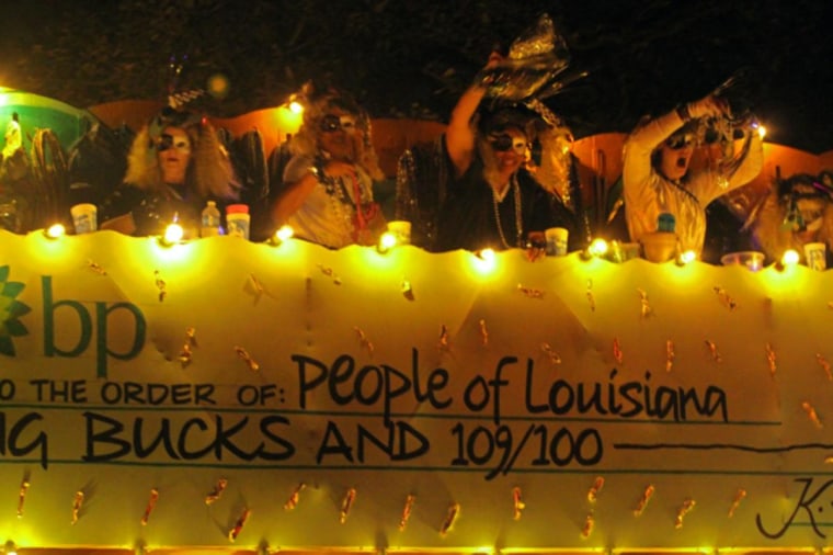 Krewe of Chaos known for their political satire...  This one is BP... The check on the side of the float bears:
pay to the order of:  People of LA.  Amount:  Big Bucks...