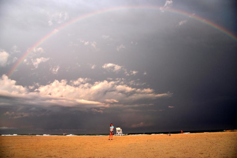 After a quick rain storm on the beach in Wildwood, NJ this beautiful rainbow appeared.  Our daughter Isabella is in the center of the rainbow.