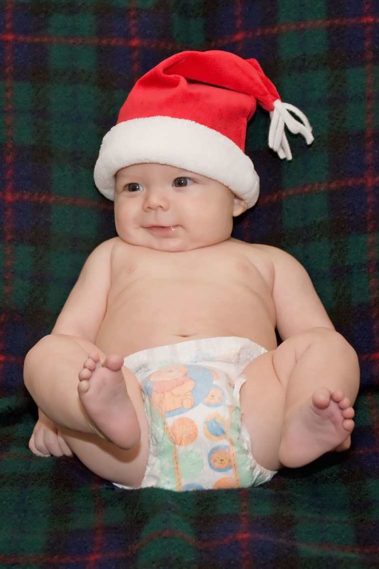 From reader Rick Welch of Des Moines, Iowa, who writes: "My wife and I were blessed with two more grandsons in 2008, which puts the total at 16 grandchildren. Their ages are 17 years down to 5 months. Baby Mason is number 16 and he is ready for Santa." What a cutie!