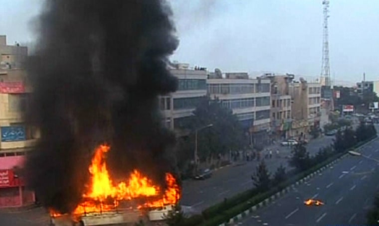 An image grab taken from Iran's satellite English-language official Press TV station shows a burning bus during a demonstration in Tehran on June 20, 2009. Thousands of Iranians clashed with police as they defied an ultimatum from supreme leader Ayatollah Ali Khamenei for an end to protests over last week's disputed presidential election.