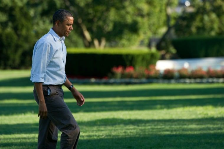 Image: US President Barack Obama walks to the O