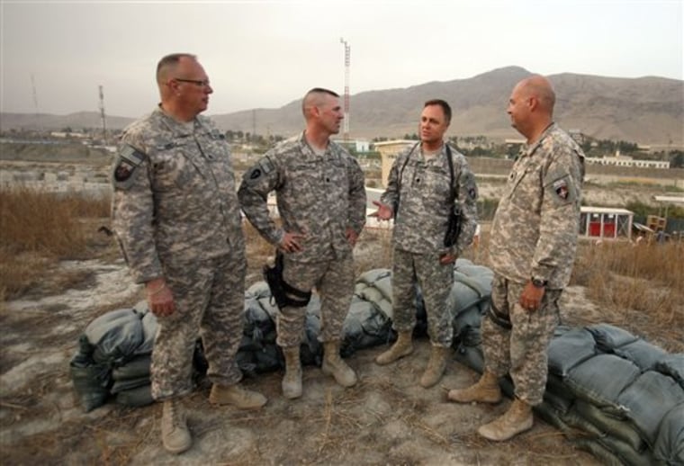 Members of a U.S. military "Red Team" gather at a base in Kabul on Sept.15. From left, Staff Sgt. Steven Dietz; Lt. Col. Bruce Ferrell; Lt. Col. Michael McGee; and Lt. Col. Brian Hammerness. 