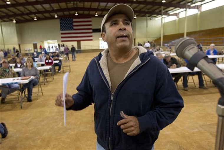 Migrant worker Fellipe Chacoa of Mexico talks about his desire to continue to harvest produce during a meeting of farmers and state officials to discuss the impact of the Alabama Immigration law on their livelihoods in Oneonta, Ala., Thursday, Oct. 20, 2011.  Chacoa said he had picked tomatoes for 26 years and that the new immigration law was scaring Hispanic workers into leaving the state to find work elsewhere. (AP Photo/Dave Martin)